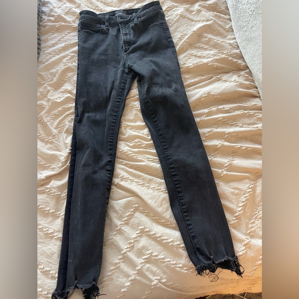 Abercrombie and Fitch black skinny jeans with distressed bottom. Size 25S.